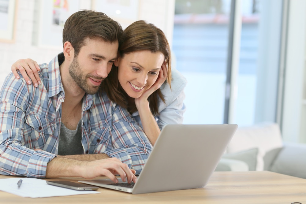 Couple,At,Home,Websurfing,On,Internet